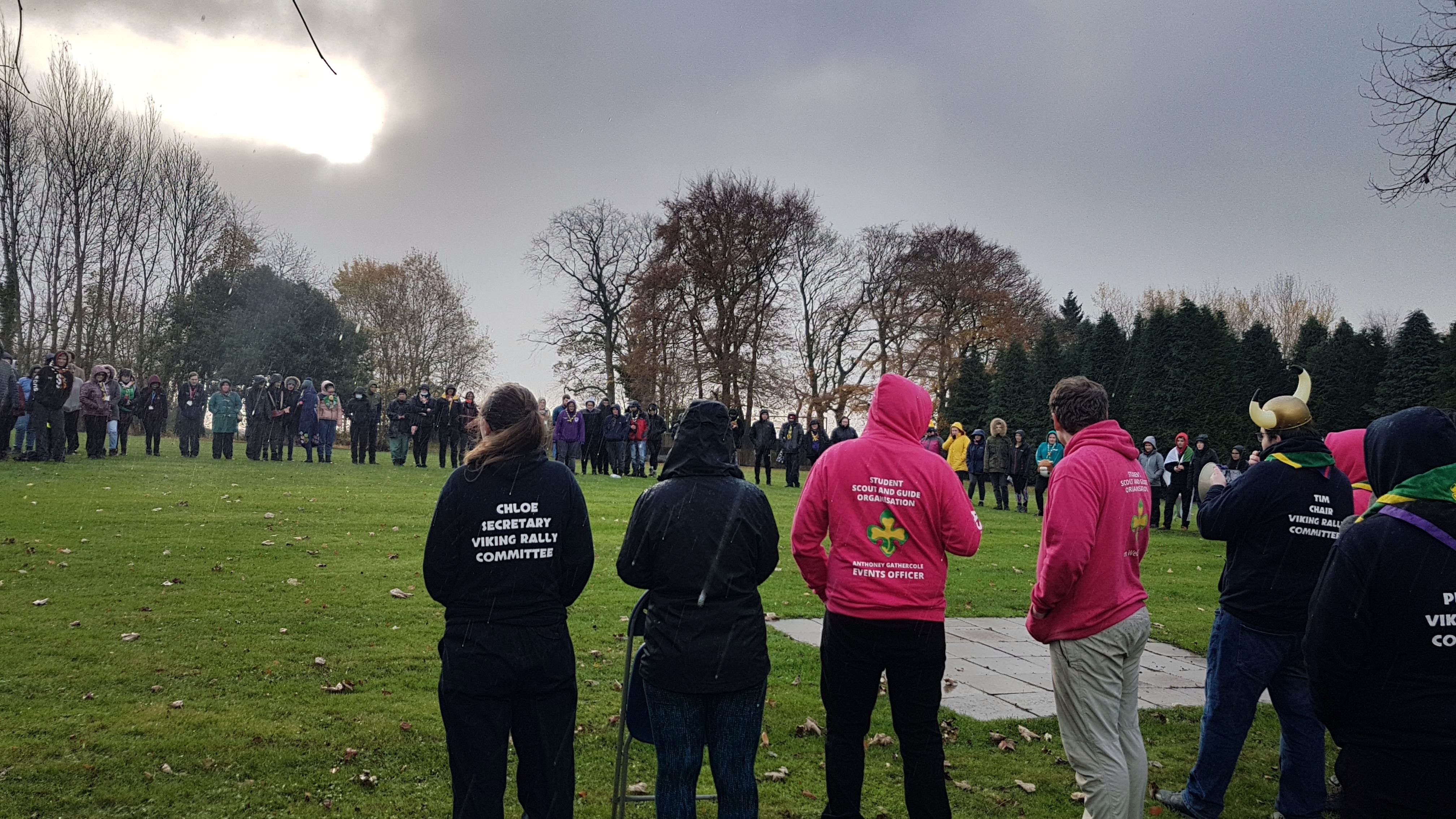 A shot from the front on the closing ceremony, looking at the backs members of the rally committee and Team Pink